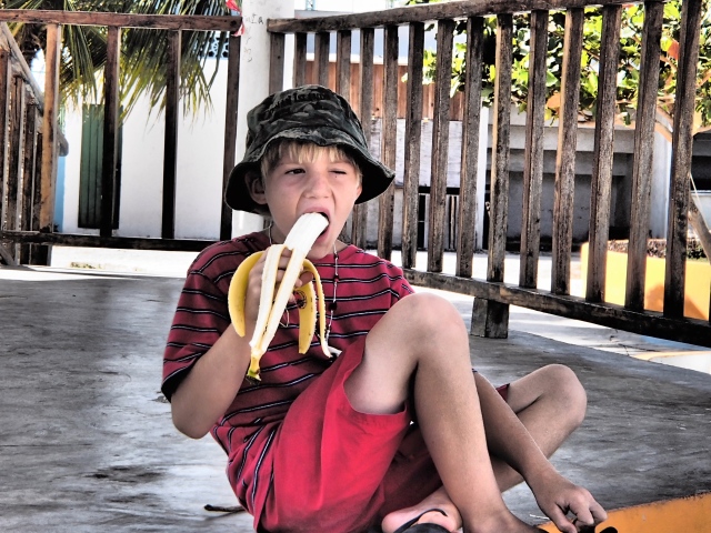 Our Little Popeye Eating a Banana